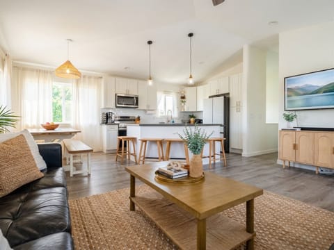 Full kitchen with dishwasher, oven / range, ridge, microwave, and kitchen appliances.