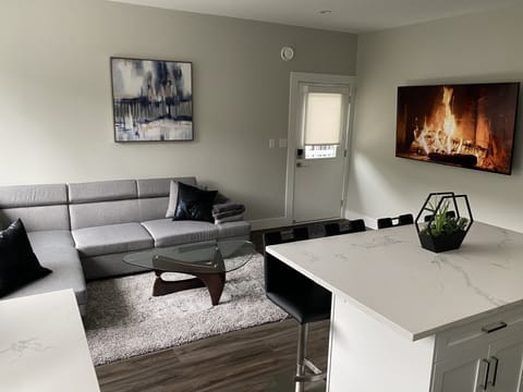 Living room with 70” TV with Premium Cable & Netflix