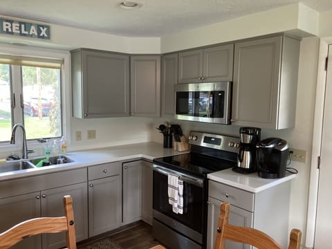 Newly renovated kitchen with all new cabinets, stainless steel appliances .