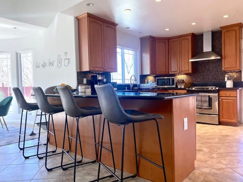 Bar seating with four bar chairs to show off your cooking skills!