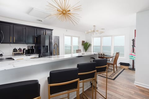 Newly remodeled galley (kitchen) with quartz countertop.