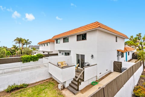 Pictured is the private fenced backyard and patio.