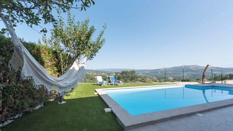 Stunning outdoor area featuring a large inviting pool, sun loungers, and the perfect setting to soak up the sun in total comfort.

#LovelyStay #OutdoorLiving #PoolVibes #RelaxAndUnwind