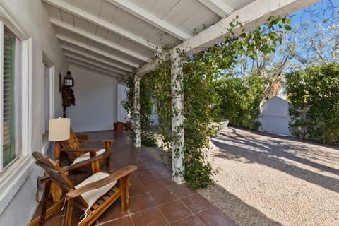 Private front porch and garden front of property 