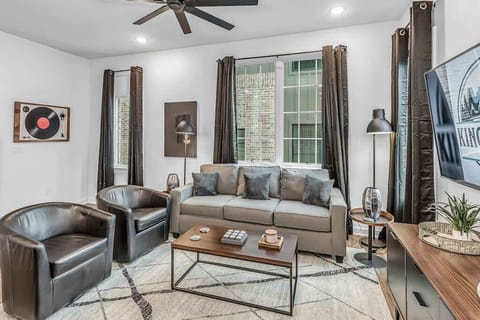 Ample seating and a central coffee table make this the go‑to spot for morning coffee, movie nights, or catching up with friends.