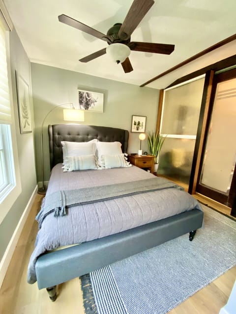 Queen sized mattress with padded headboard and high quality linens