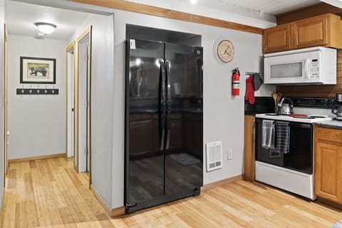 Clean kitchen with ample storage space