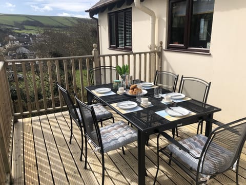 The kitchen leads directly to the raised deck eating area.