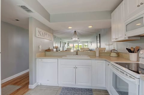 The Kitchen Opens Up to the Dining and Family Rooms
