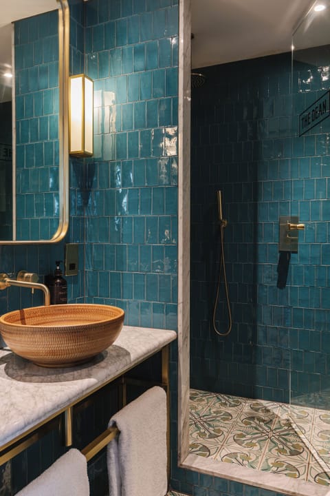 The Cosy | Bathroom | Rainfall showerhead, hair dryer, slippers, towels