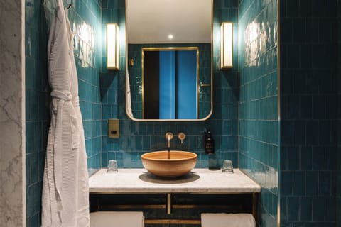 The Double | Bathroom | Rainfall showerhead, hair dryer, slippers, towels