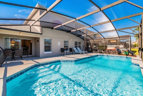 Bask in the shimmering light reflecting off the crystal-clear pool, surrounded by a spacious patio perfect for sunbathing or dining. Enjoy the seamless flow between indoor and outdoor spaces, ideal for relaxation and gatherings.