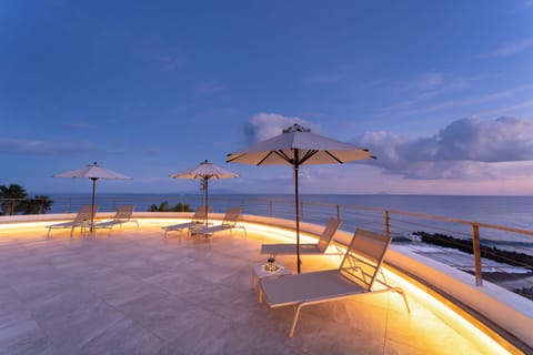 Seasonal outdoor pool, open 9:00 AM to 9:00 PM, pool umbrellas