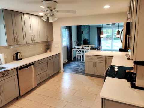 Luxurious kitchen with stainless steel appliances and quartz countertops