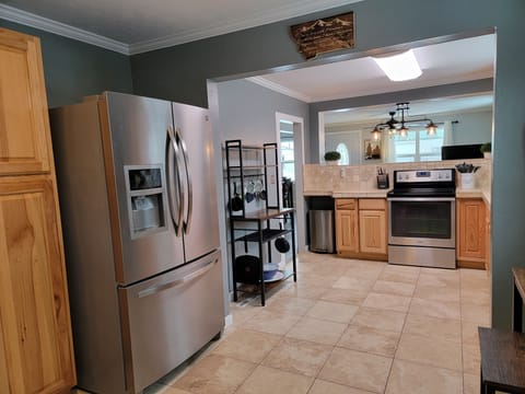 Stainless fridge and freezer. Please bring your own ice from the store. 