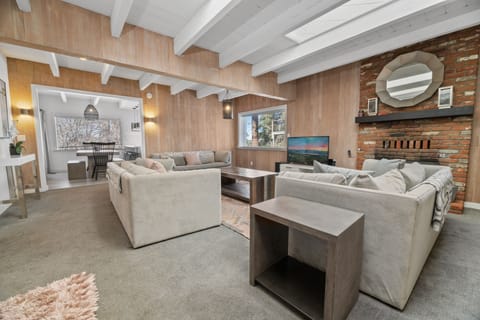 Large Spacious Living Area with Fireplace and Large TV with Streaming Services