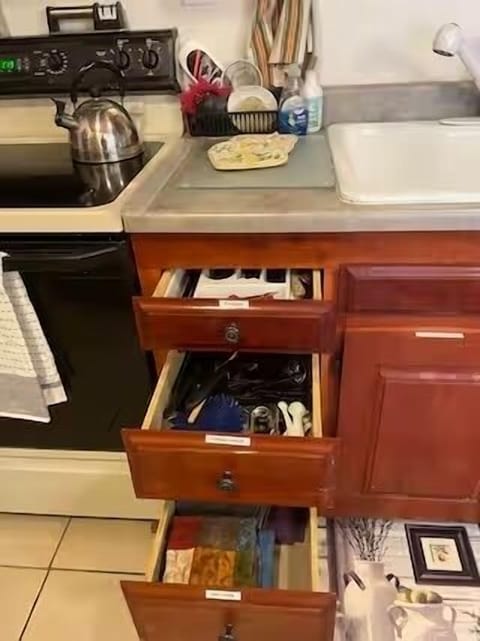 Kitchen utensils. Silverware, towels, dish cloths, can opener etc.