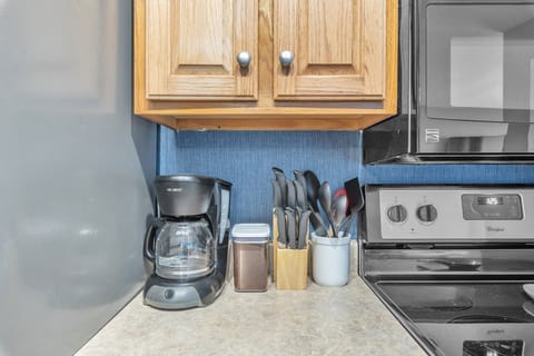 Coffee stored in air tight container. Plenty of cooking utensils.