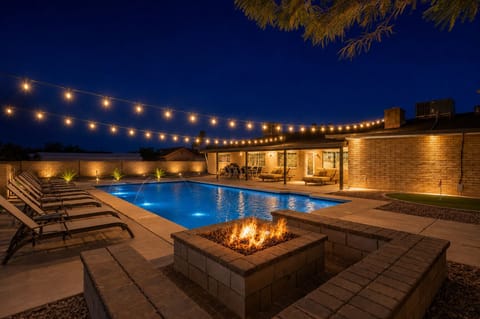 Gas firepit conversation area for 12 is amazing at night.