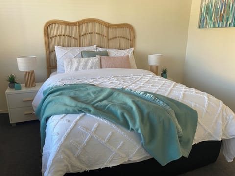 Relax off to sleep in a queen size bed with attached ensuite