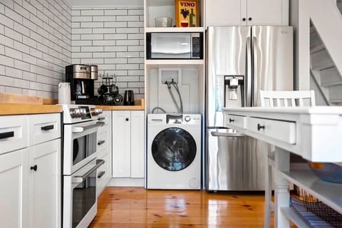 New washer/dryer all-in-one, new coffee maker with choice of brew pot or pods, microwave, fridge/freezer.