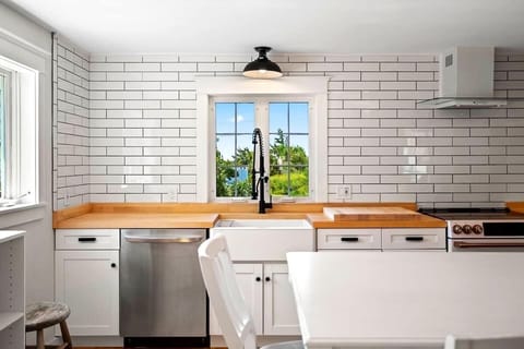 Butcher block counter tops and farm house sink.
