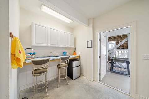 Food prep with refrigerator adjacent to outdoor grill. Picnic basketball for use