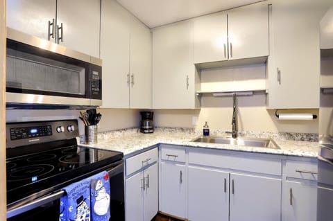 Fully equipped kitchen with smooth granite countertops and stainless appliances

Ample cabinet space and modern pull-down faucet for cooking convenience

Perfect spot to prepare meals with everything neatly within arm’s reach

