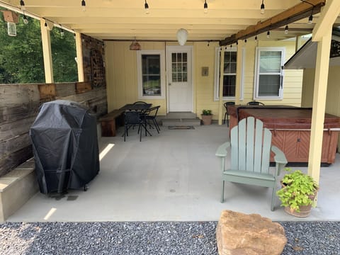 Back patio with view of back door and hot tub.