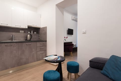 Superior Studio Suite, Sea View | Private kitchen | Fridge, electric kettle, blender, cleaning supplies