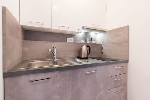 Superior Studio Suite, Sea View | Private kitchenette | Fridge, electric kettle, blender, cleaning supplies