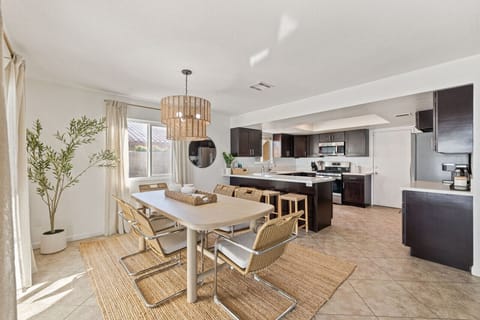 Airy dining area w/ modern table set just off the kitchen for easy shared meals