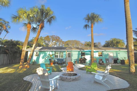 Welcome to the Parrot Head Tiki! The Beautiful Backyard boasts a built in firepit with Adirondack chairs, plenty of lounging areas and an outdoor bar