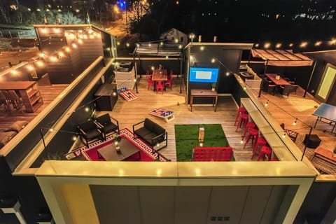 Gather on the roof for games, dinner, and some TV