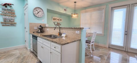 Equipped with double sink and dishwasher.