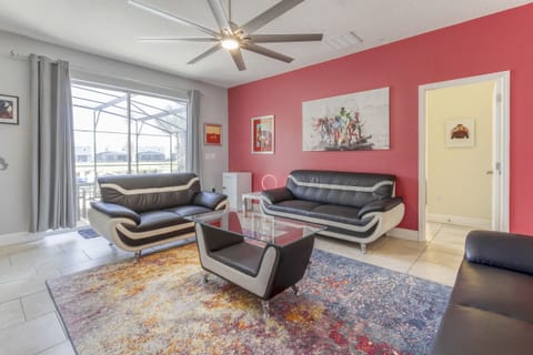 The living room features modern furniture complimenting all the wonderful artwork.