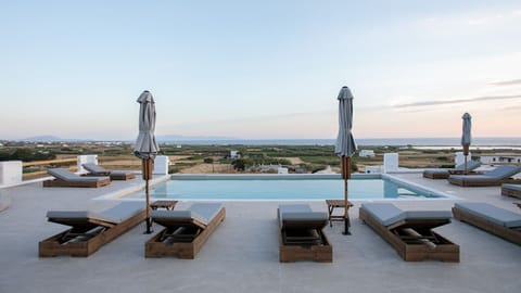 Seasonal outdoor pool, open 8:00 AM to 9:00 PM, pool umbrellas