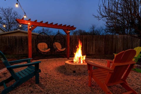 Unwind under the stars — fire pit, egg chairs, and your private backyard retreat