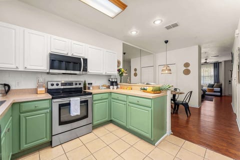 Full service Kitchen has a refrigerator, new range, dishwasher, microwave, coffee maker, teapot, and toaster. Also includes plates, bowls, cups, silverware, cookware set, and cooking utensils as well as complimentary coffee, tea, sugar and creamer.