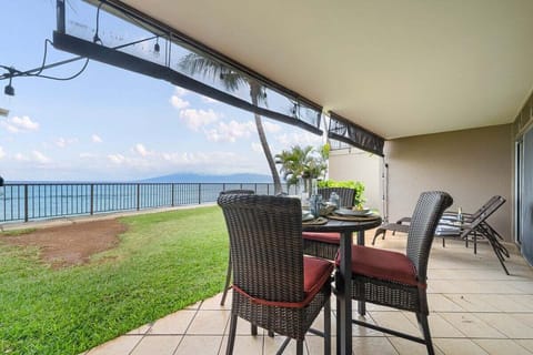 Enjoy meals or drinks on this private patio with stunning ocean views and fresh island breezes