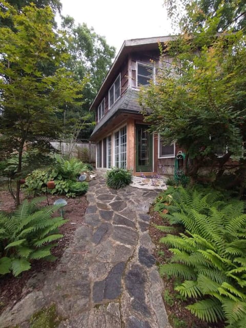 Take the meandering stone pathway to the door of the Raleigh Mill House