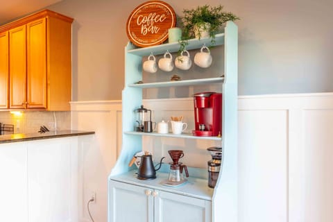 Coffee bar next to the kitchen, features keurig, french press, pour over & drip