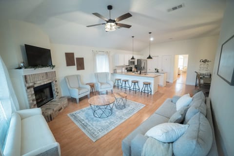 Stylish but cozy living space with lots of seating and modern farmhouse touches.