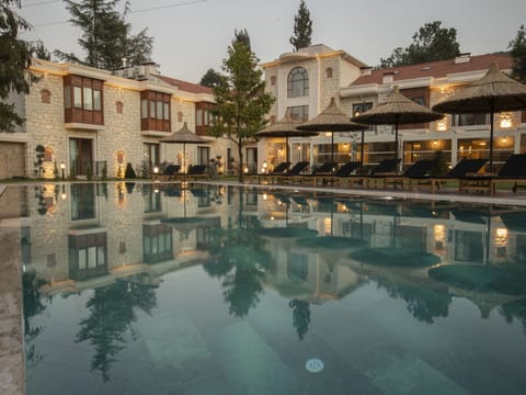 Outdoor pool, pool umbrellas, sun loungers