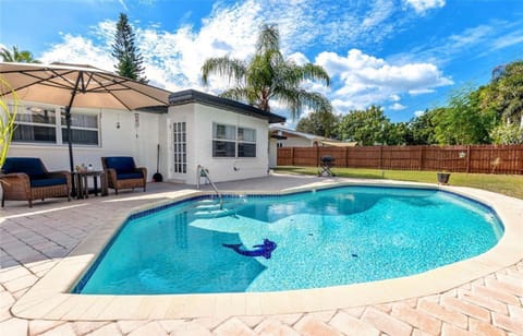 Lounge by the pool, using the provided pool floats/lounger