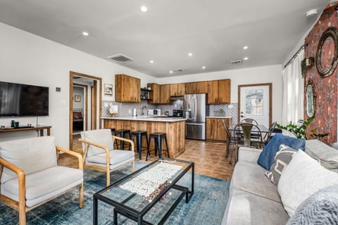 Bright open-concept space for cooking, dining, and relaxing.