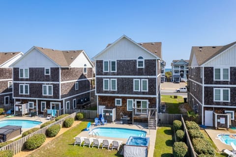 NH187: Driftwood Tides | Rear Exterior & Pool Area