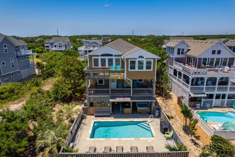 NH285: Beach Brum | Aerial View - Rear Exterior & Pool/Hot Tub Area