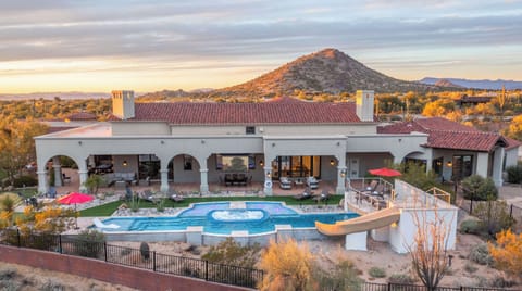 The Estate showcases stunning desert contemporary design with its grand archways.