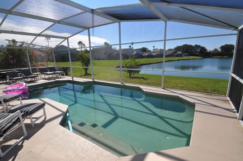 View from pool decking overlooking private lake